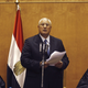 Adli Mansour (C), Egypt's chief justice and head of the Supreme Constitutional Court, speaks at his swearing in ceremony as the nation's interim president in Cairo
